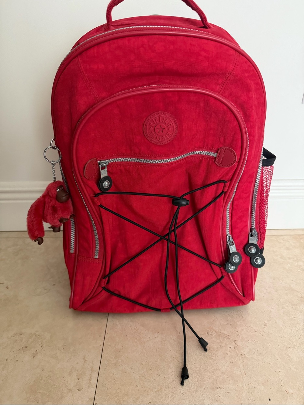Kipling Bright Red Rolling Backpack with Monkey Charm